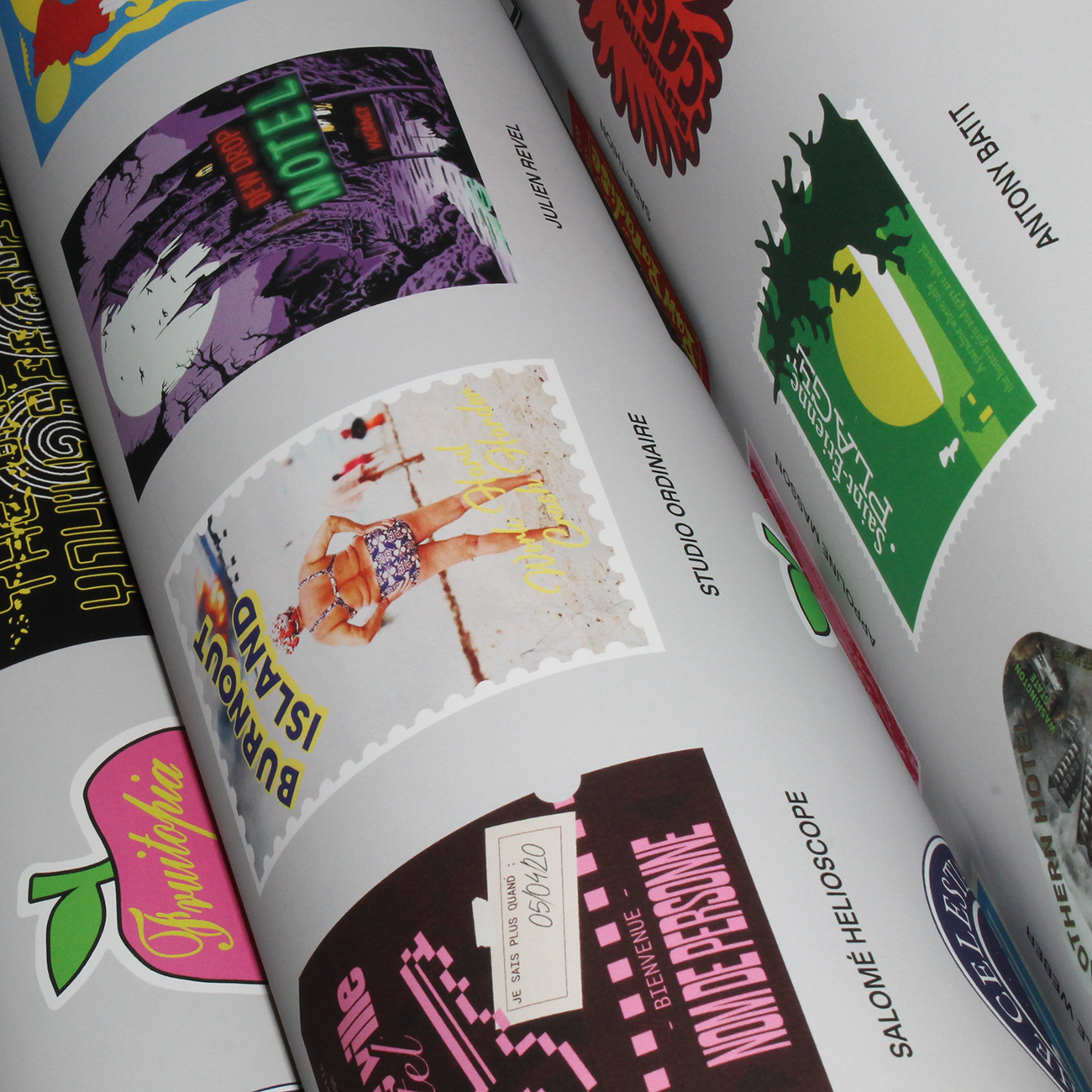 rolled up posters with colorful designs with the text "MOTEL" and "FRUITOPIA"