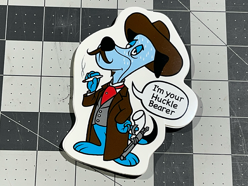 A sticker of a blue dog in a coat